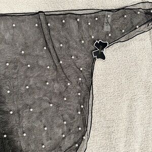 Black cover up with pearls on it. See through. New with tag